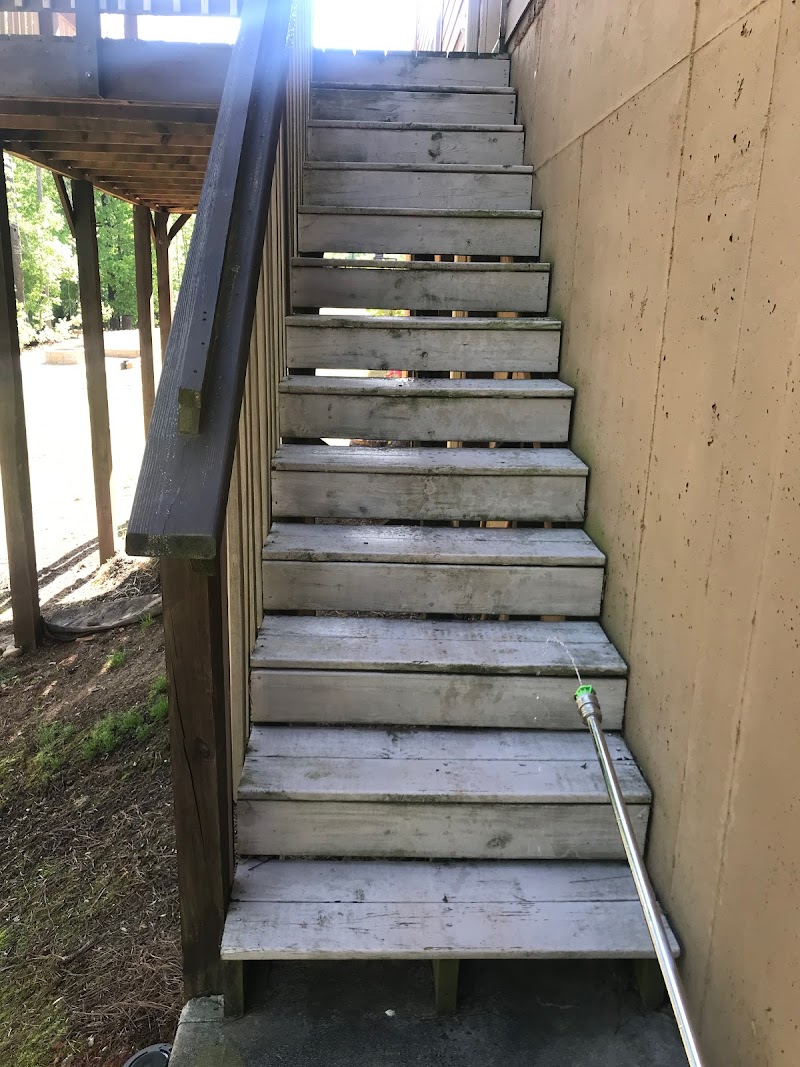 Vinyl siding restored to clean white after pressure washing